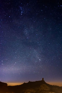 Scenic view of star field against sky at night