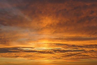 Scenic view of dramatic sky during sunset