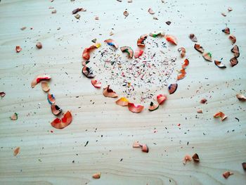 High angle view of i love you text made from pencil shavings