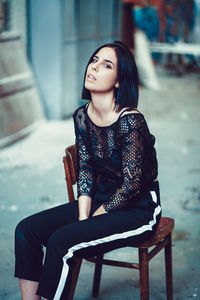 Portrait of young woman in abandoned room