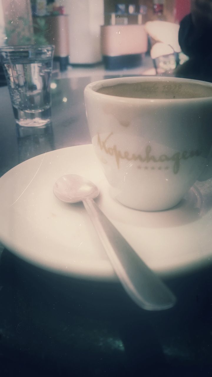 food and drink, indoors, drink, freshness, refreshment, table, close-up, drinking glass, focus on foreground, plate, white color, spoon, still life, restaurant, water, food, ready-to-eat, sweet food, selective focus, indulgence