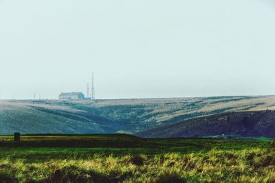 Scenic view of agricultural field against clear sky