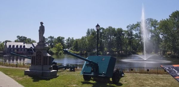 Fountain in park against sky