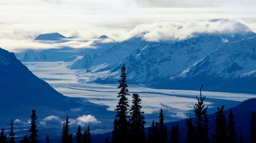 Scenic view of snowcapped mountains against sky