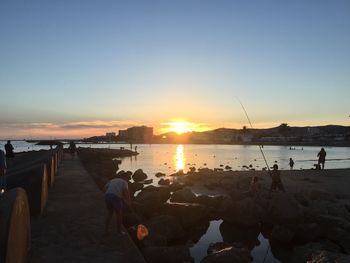 Scenic view of lake at sunset