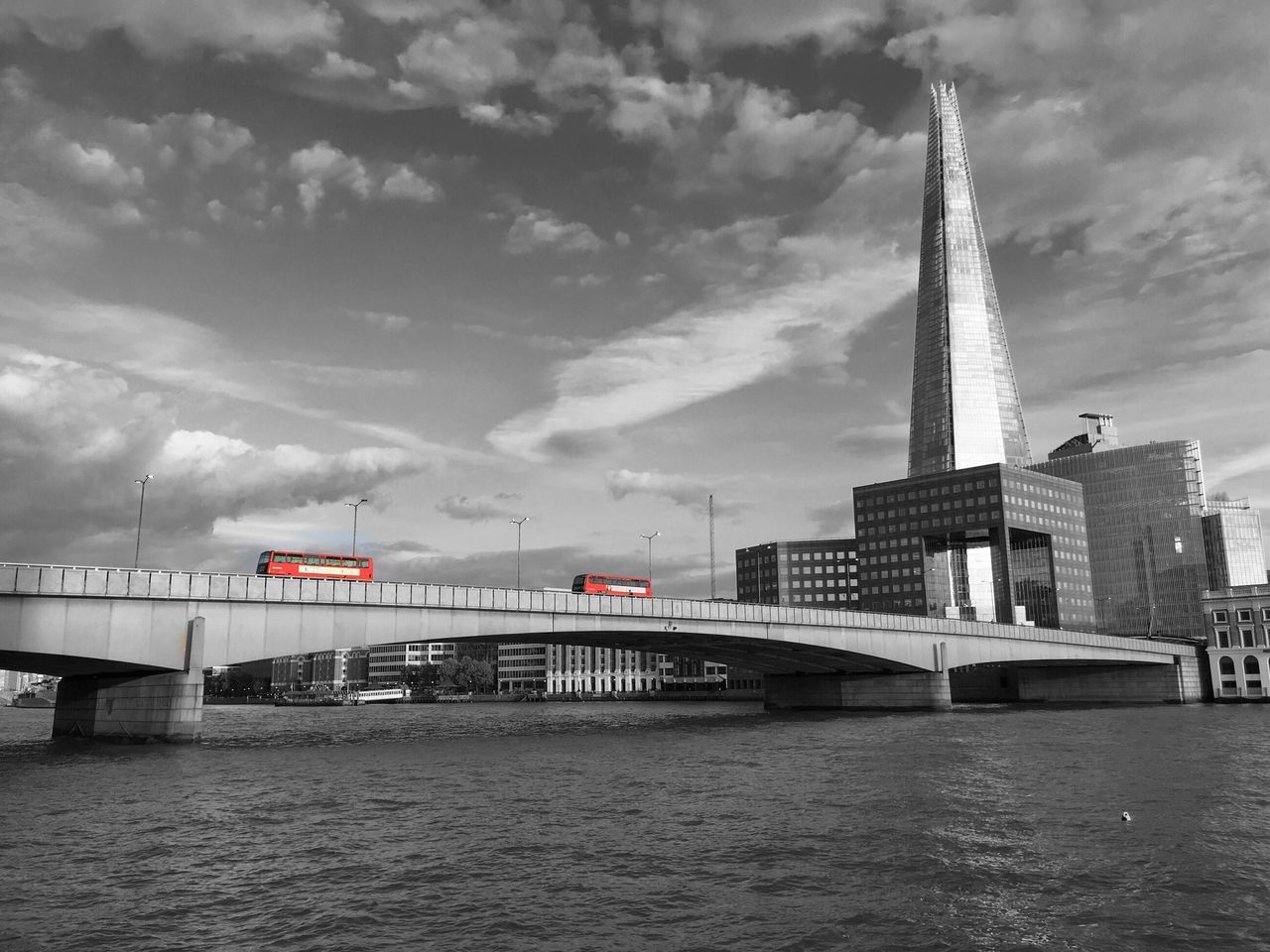 VIEW OF RIVER WITH BUILDINGS IN BACKGROUND