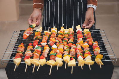 Man preparing food on barbecue grill