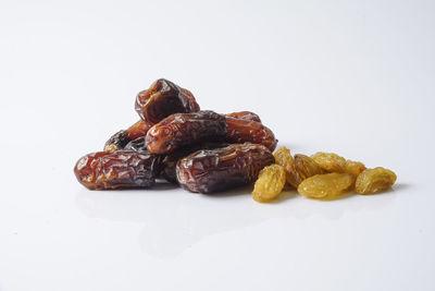 Close-up of fruits against white background