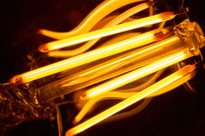 Close-up of yellow fire against black background