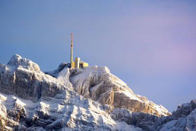 Scenic view of snowcapped mountains against clear sky