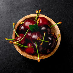 High angle view of red chili pepper against black background