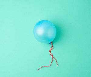 Close-up of balloons against blue background