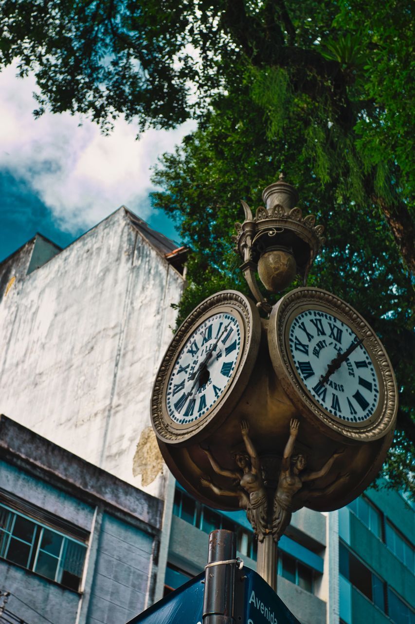 LOW ANGLE VIEW OF CLOCK ON BUILDING