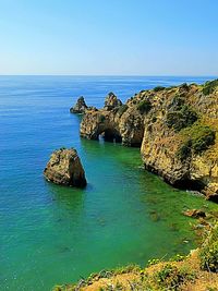 Scenic view of sea against blue sky