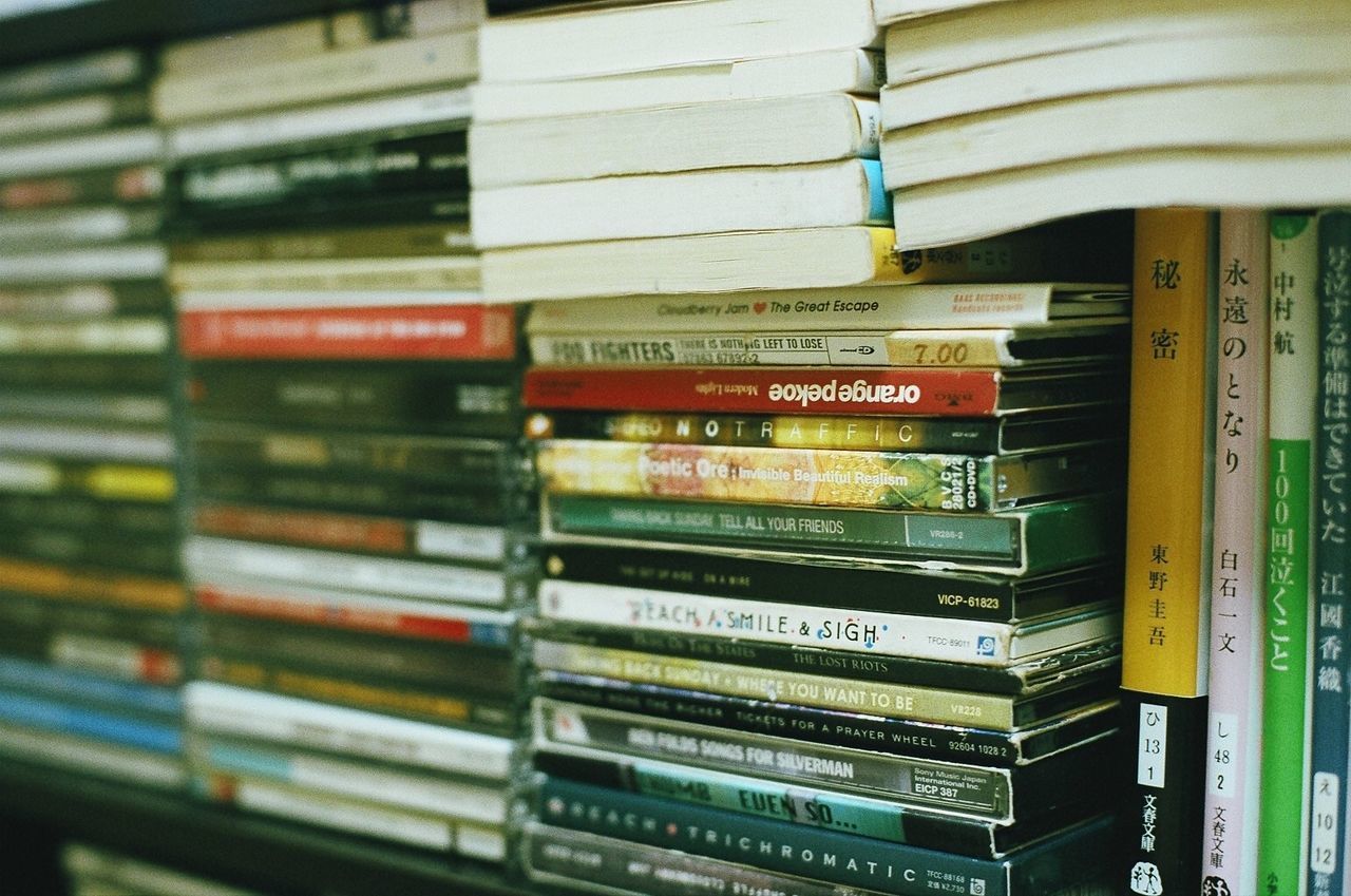 CLOSE-UP OF BOOKS ON SHELF