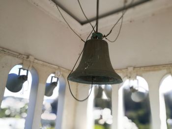 Low angle view of light bulbs hanging