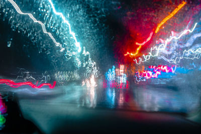 Light trails seen through car windshield