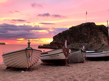 Boats moored at beach