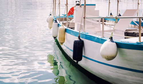 Close-up of boat moored on sea