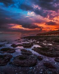 Scenic view of sea against sky at sunset