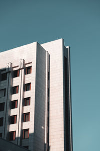 Low angle view of building against clear blue sky