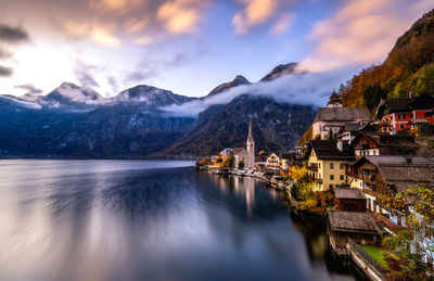 Scenic view of lake and mountains against sky