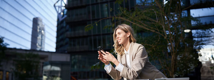 Young woman using mobile phone