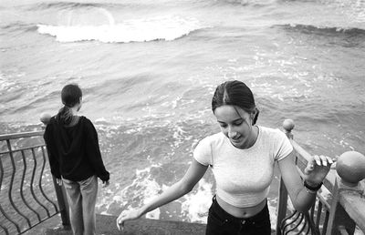 Friends standing on beach