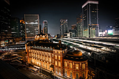 High angle view of illuminated buildings in city at night