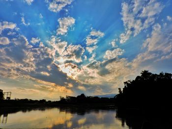 Scenic view of lake at sunset