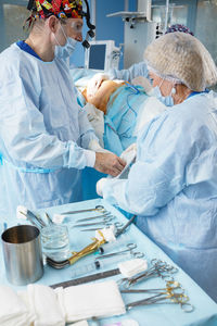 High angle view of doctor examining patient at clinic