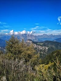 Scenic view of land against blue sky