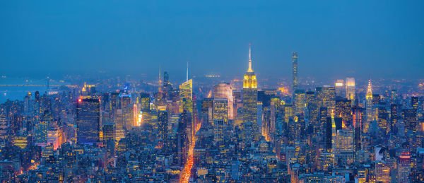 High angle view of cityscape against clear blue sky