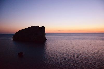 Scenic view of sea against clear sky during sunset