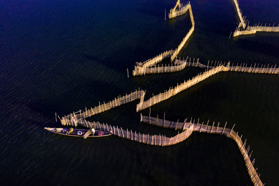 High angle view of illuminated bridge over sea