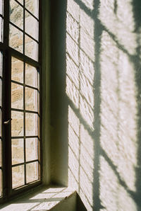 Shadow of window on wall of building