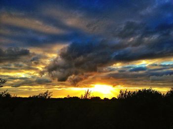 Scenic view of landscape against cloudy sky