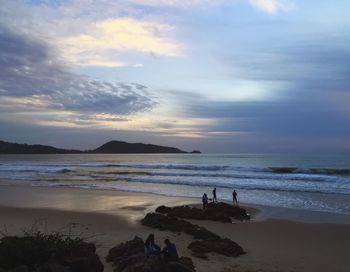 Scenic view of beach against sky during sunset