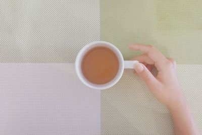 Directly above shot of coffee cup on table