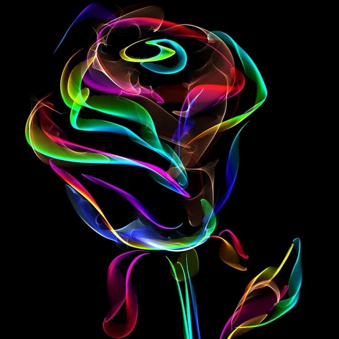 CLOSE-UP OF COLORFUL LIGHT PAINTING OVER BLACK BACKGROUND