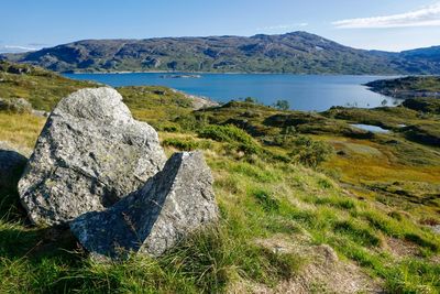 Scenic view of land and sea against sky