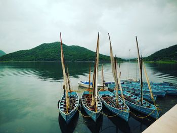 Boats moored at dock