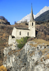 Historic building against mountain range