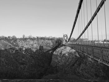 View of bridge in city against clear sky