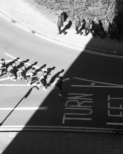 High angle view of people on zebra crossing