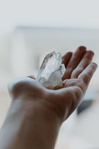 Close-up of hand holding crystals