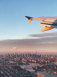 Aerial view of buildings in city against sky