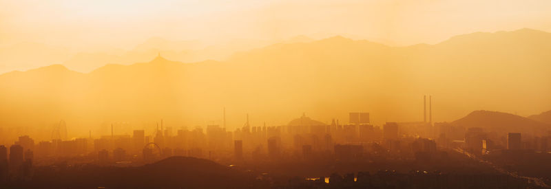 High angle view of cityscape against sky during sunset