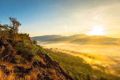 Scenic view of mountains against sky during sunset