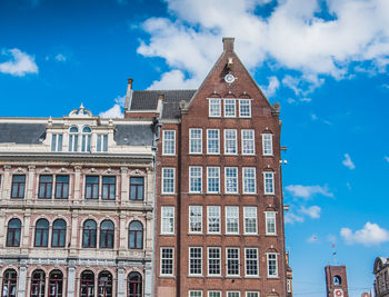 Low angle view of building against cloudy sky